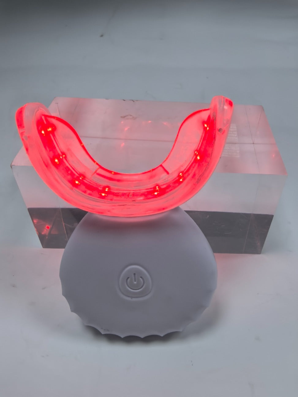 LED teeth whitening device in use